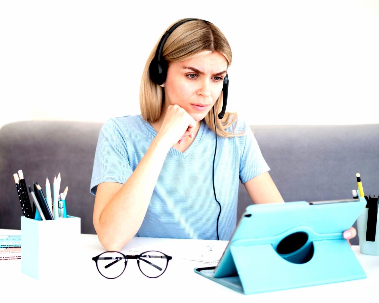Student working through financial analysis exercises on laptop